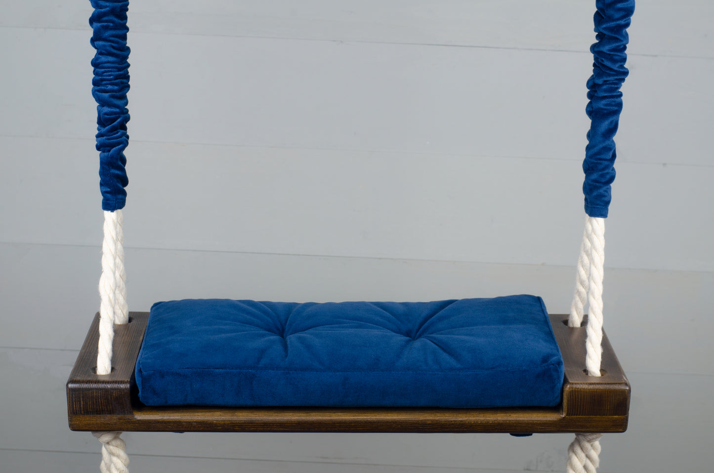 Children's Inside Natural Swing With A Blue Seat