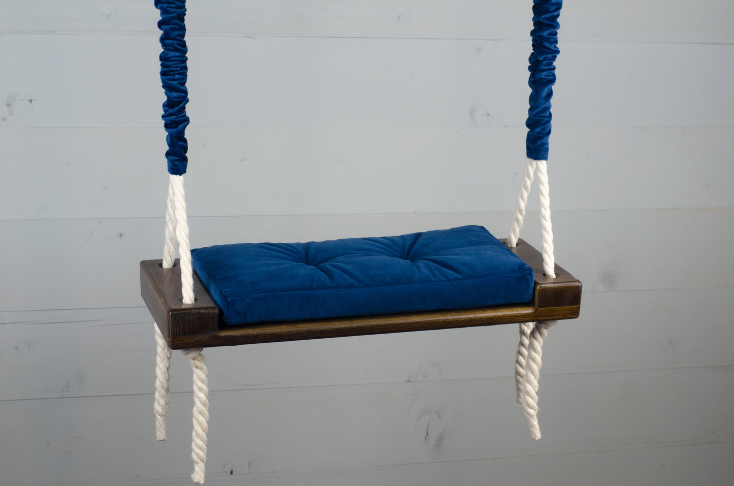 Children's Inside Natural Swing With A Blue Seat