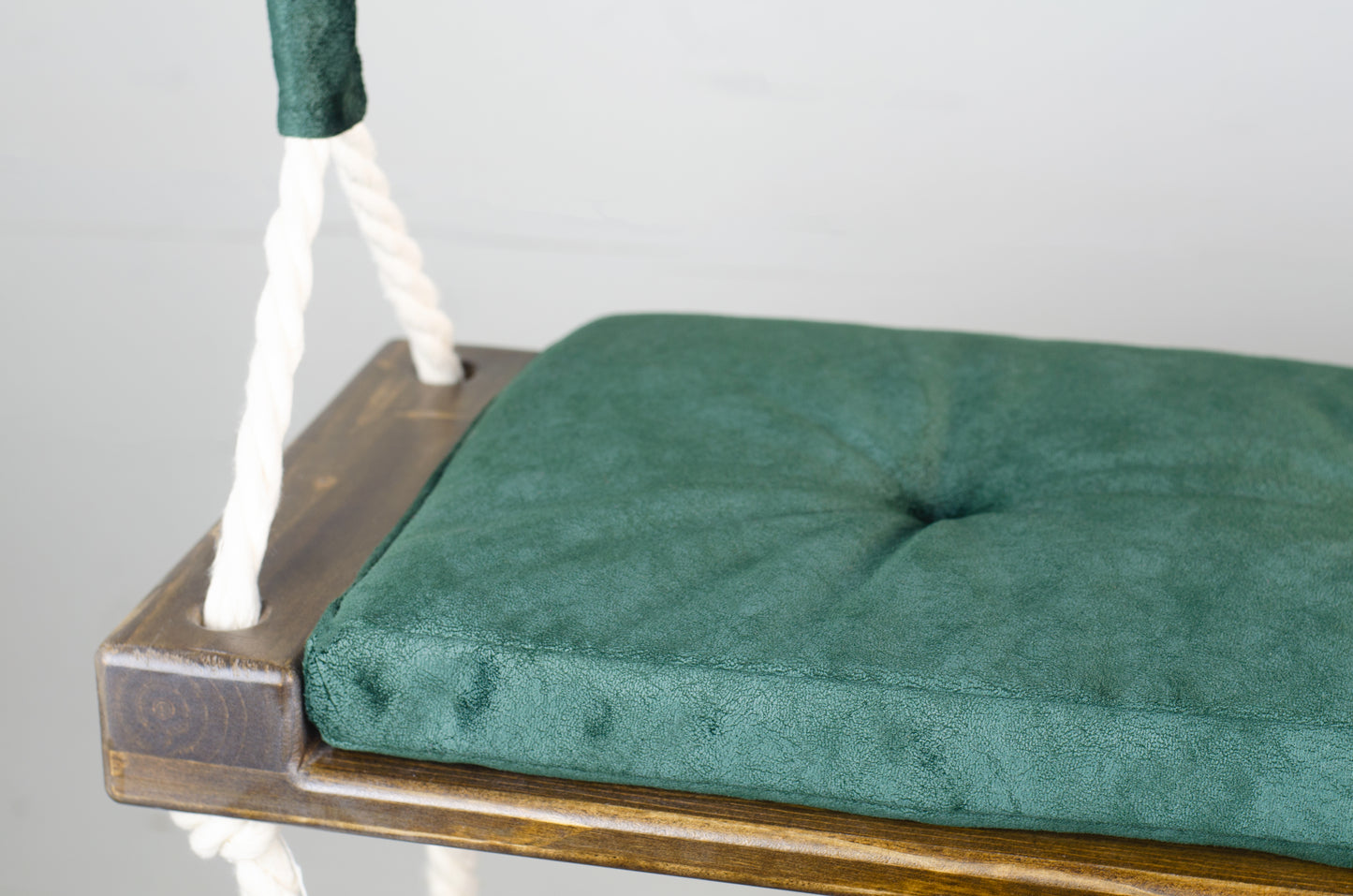 Adult Inside Natural Swing With A Green Seat