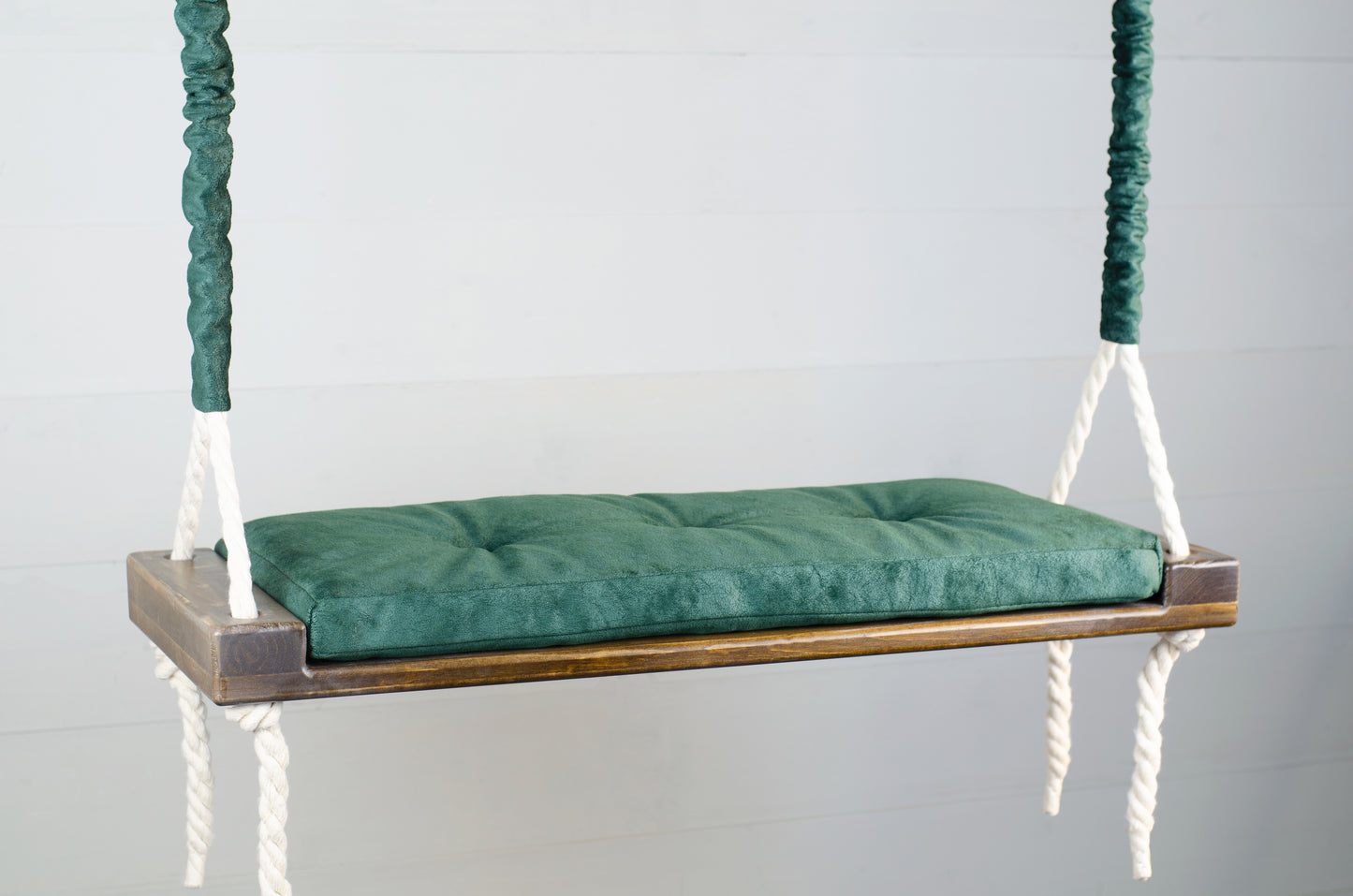 Adult Inside Natural Swing With A Green Seat