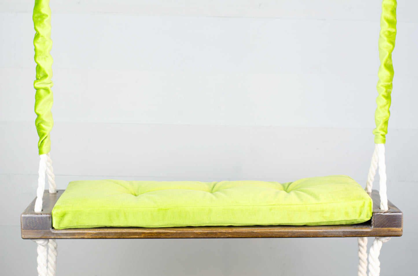 Adult Inside Natural Swing With A Green Seat