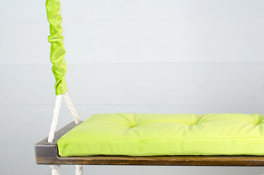 Adult Inside Natural Swing With A Green Seat