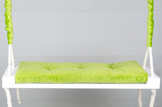 Adult Inside White Swing With A Green Seat