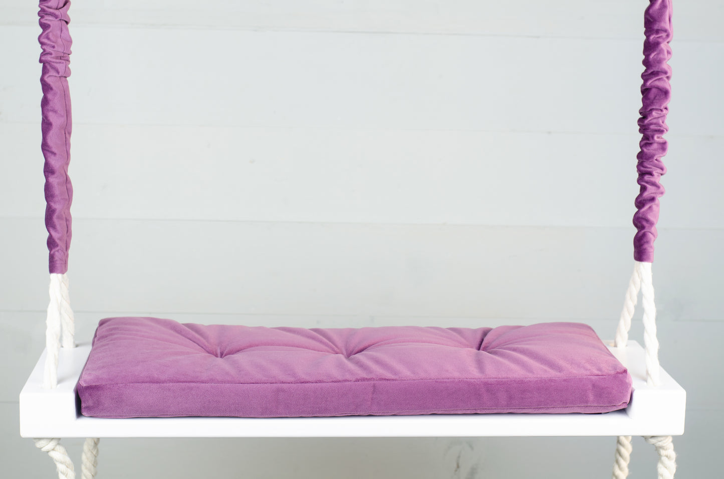 Adult Inside White Swing With A Purple Seat