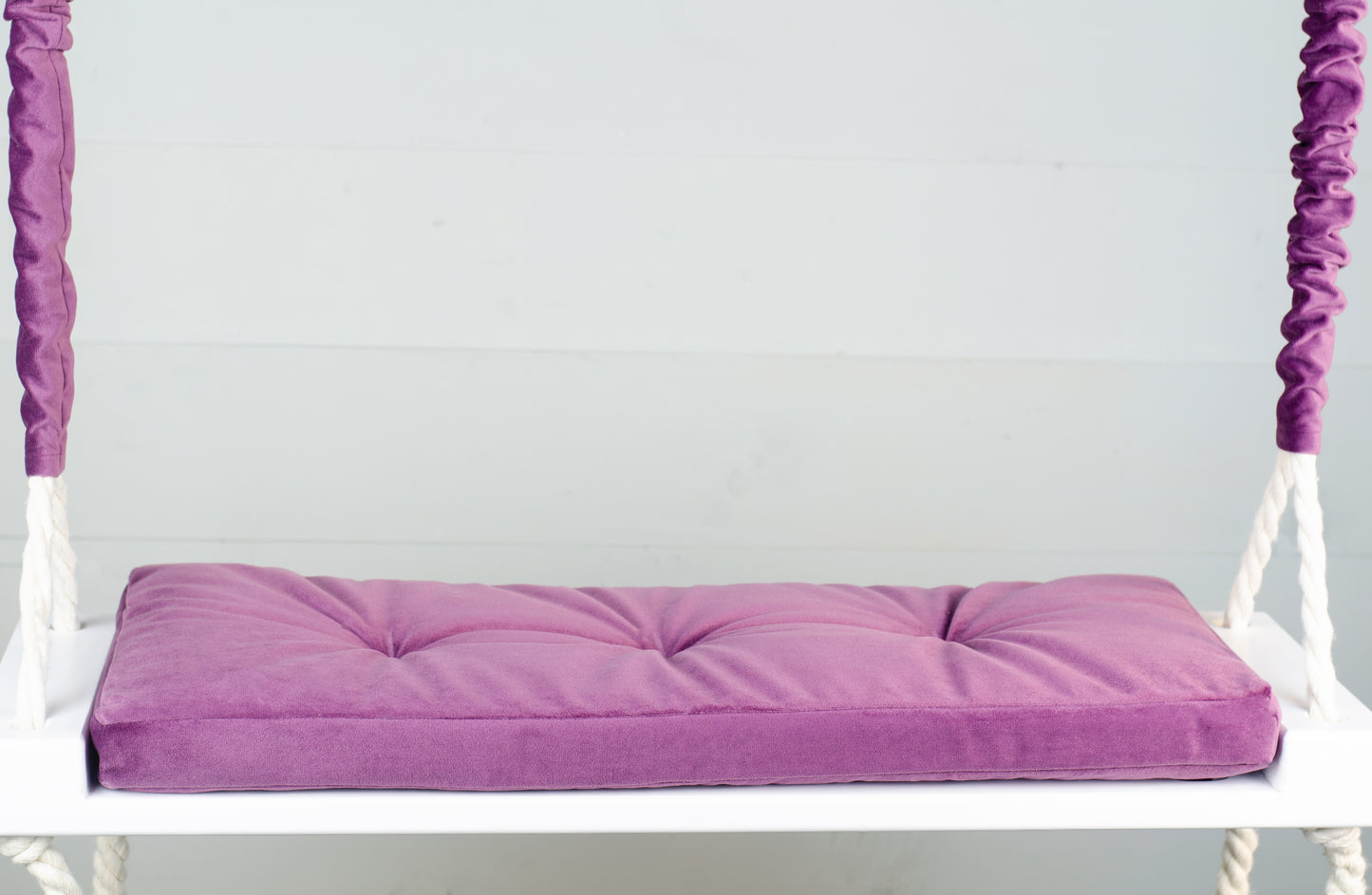 Adult Inside White Swing With A Purple Seat