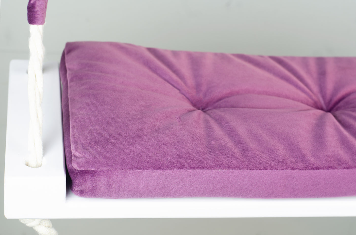 Adult Inside White Swing With A Purple Seat