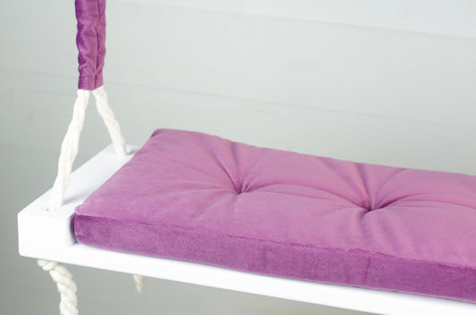 Adult Inside White Swing With A Purple Seat