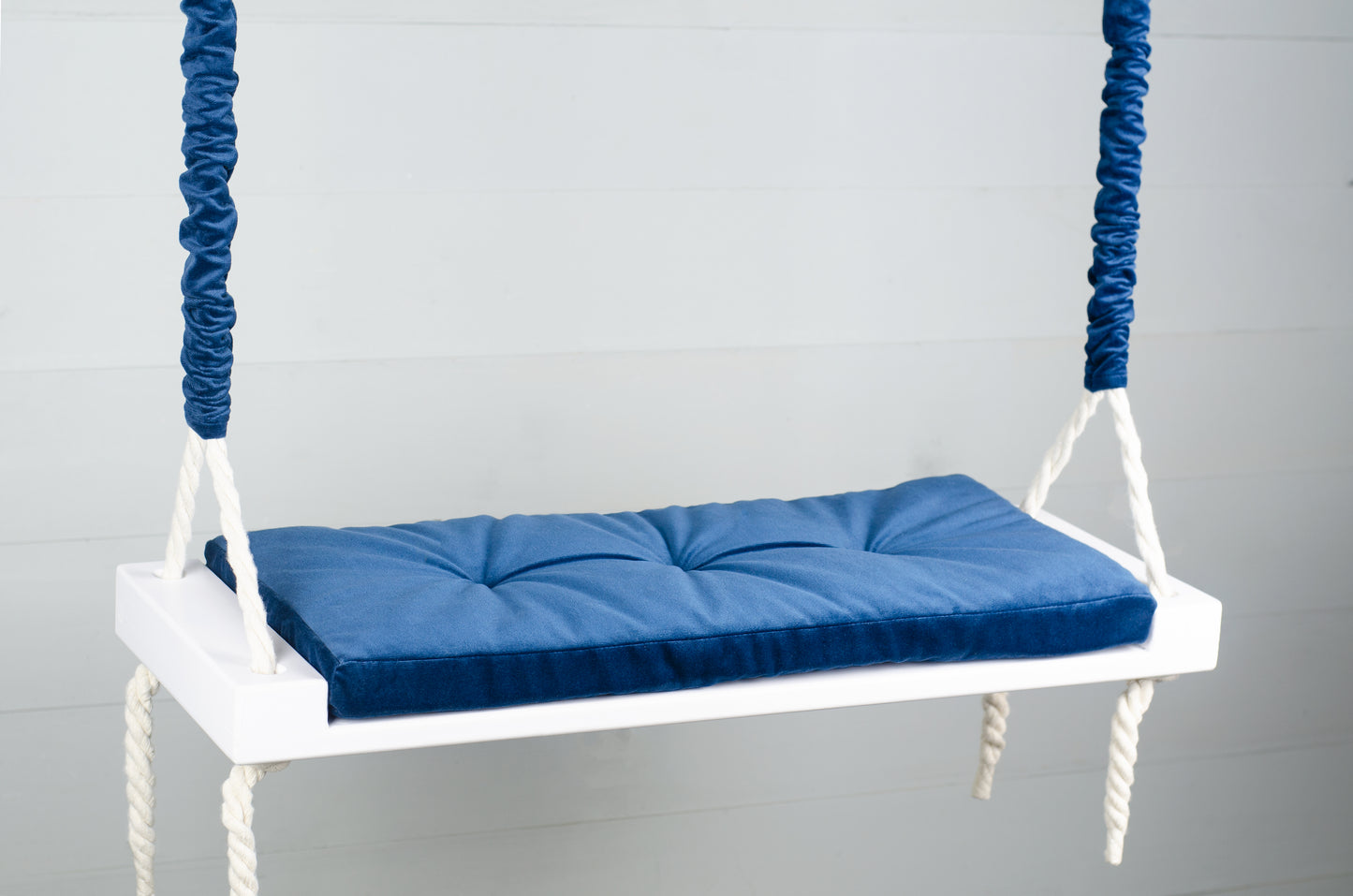 Adult Inside White Swing With A Blue Seat
