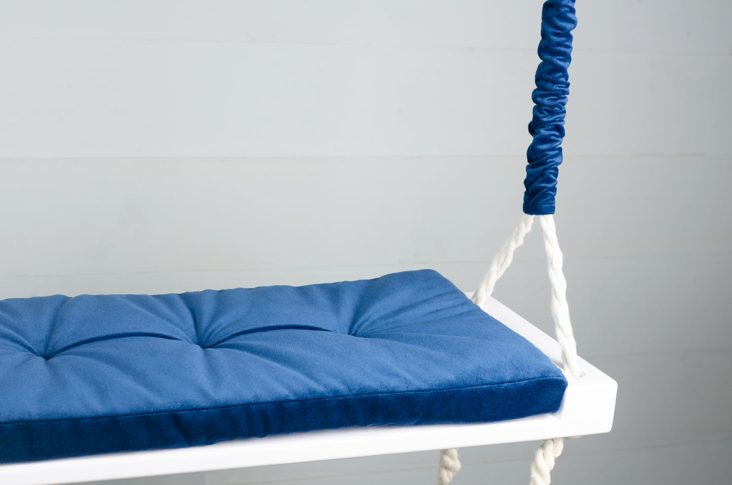 Adult Inside White Swing With A Blue Seat