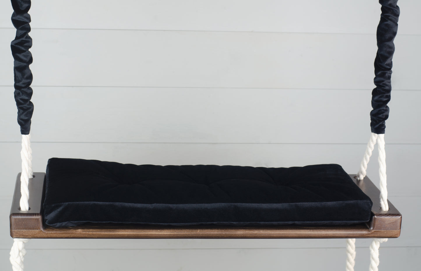 Adult Inside Natural Swing With A Black Seat