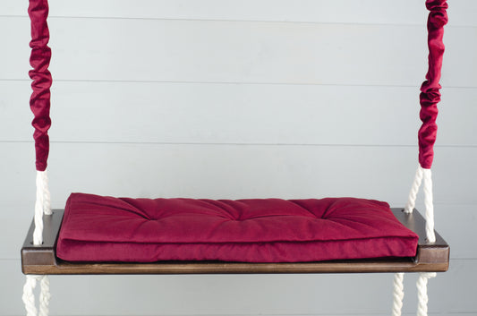 Adult Inside Natural Swing With A Red Seat