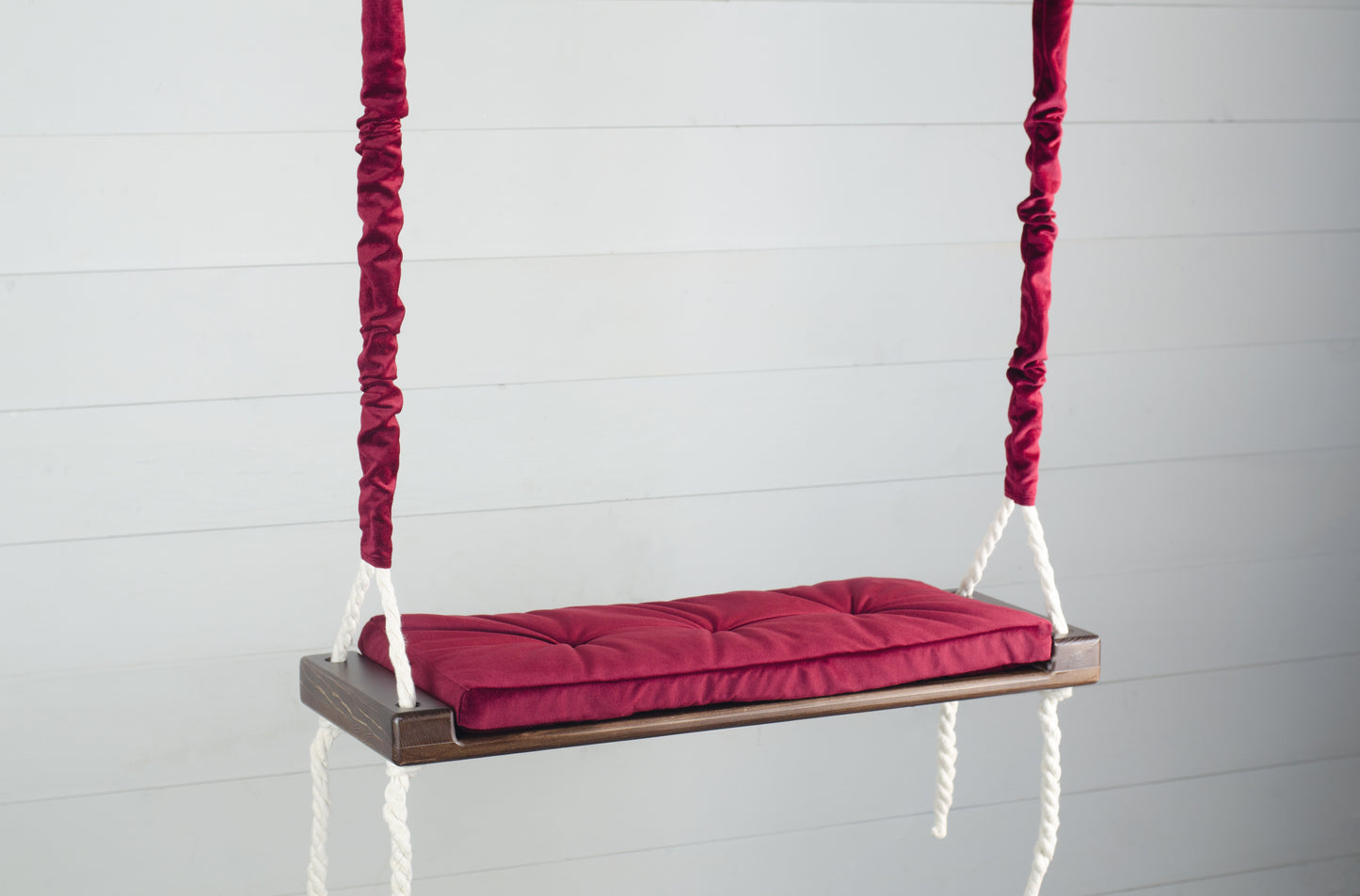 Adult Inside Natural Swing With A Red Seat