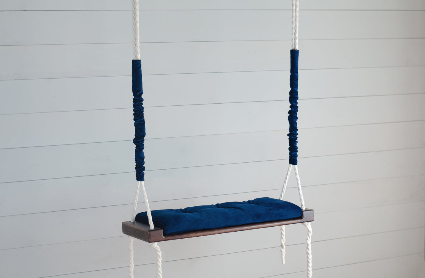 Adult Inside Natural Swing With A Blue Seat