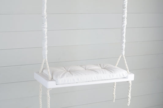 Adult Inside White Swing With A White Seat