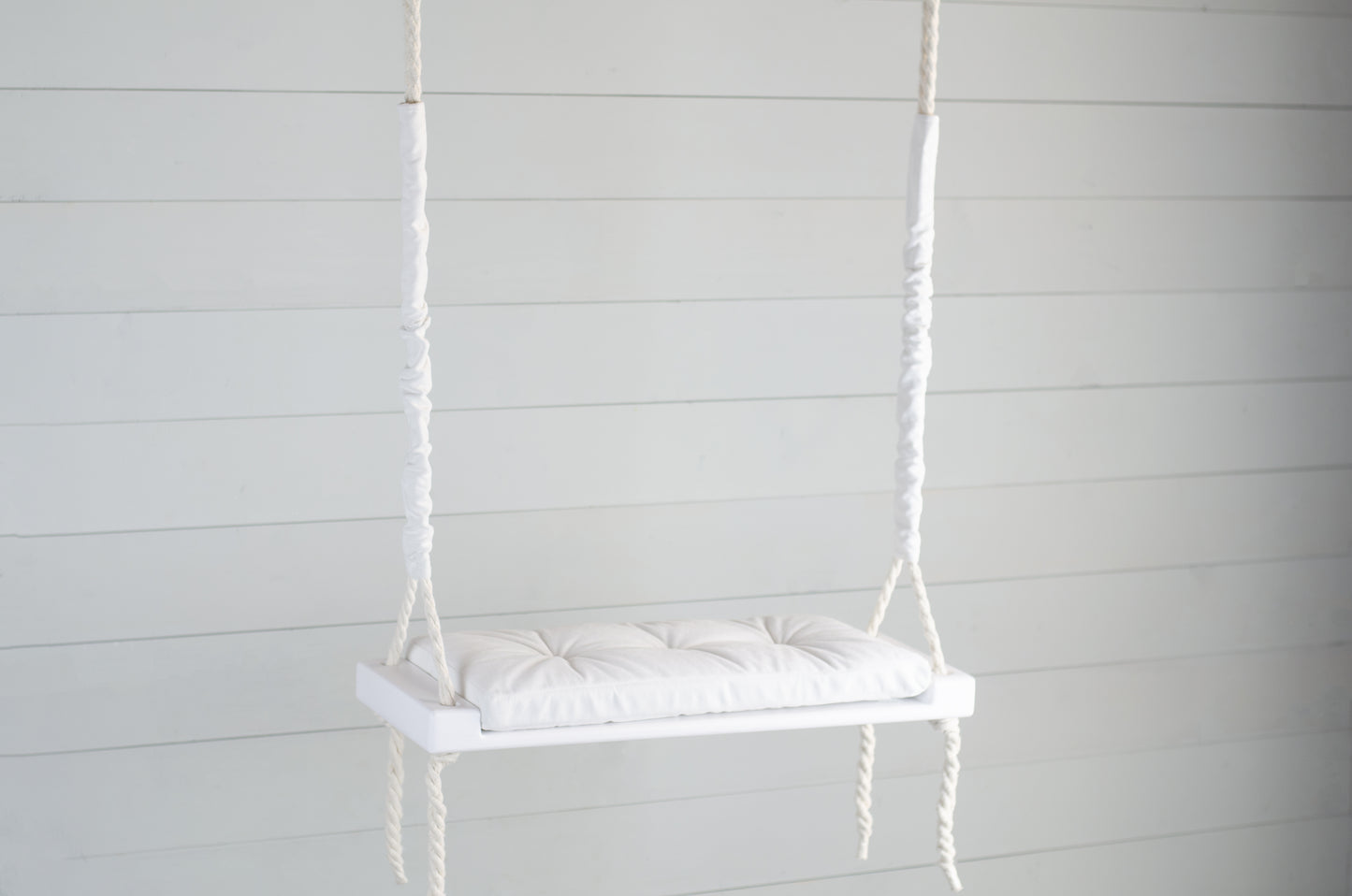 Adult Inside White Swing With A White Seat