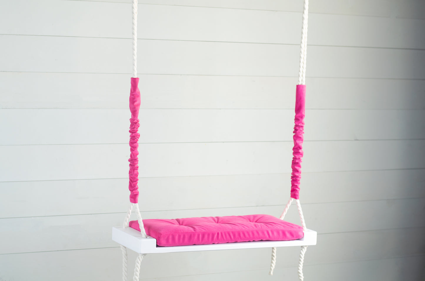 Adult Inside White Swing With A Hot Pink Seat