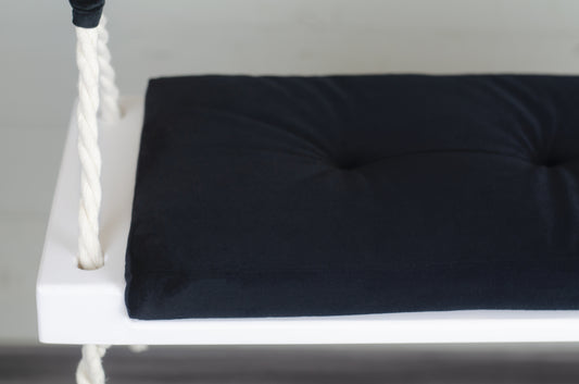 Adult Inside White Swing With A Black Seat