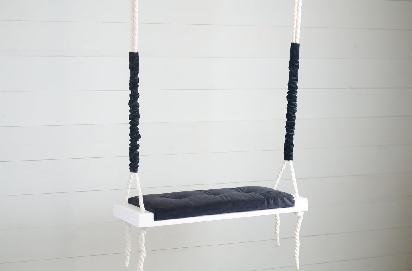 Adult Inside White Swing With A Black Seat