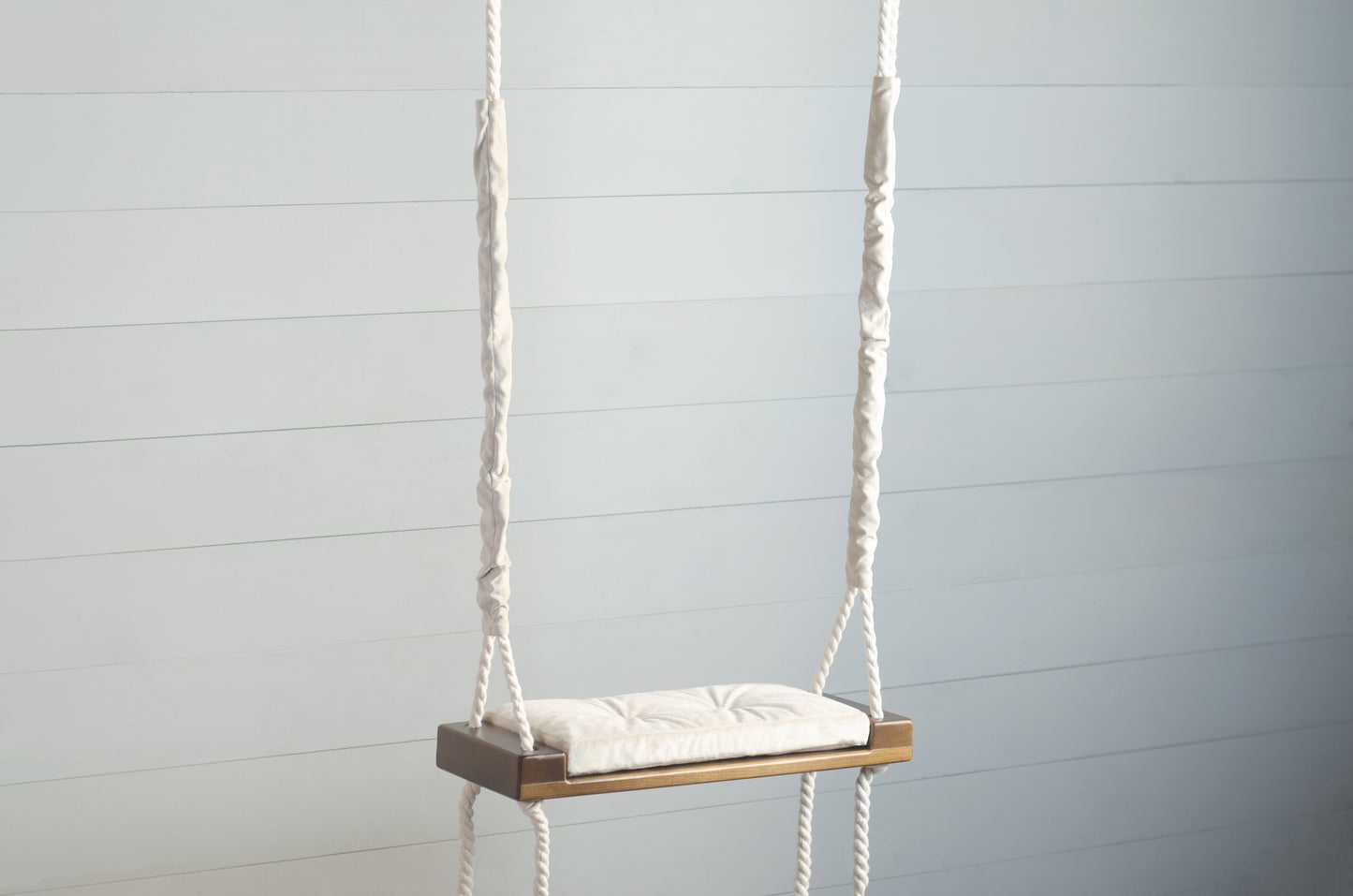 Children's Inside Natural Swing With A Beige Seat