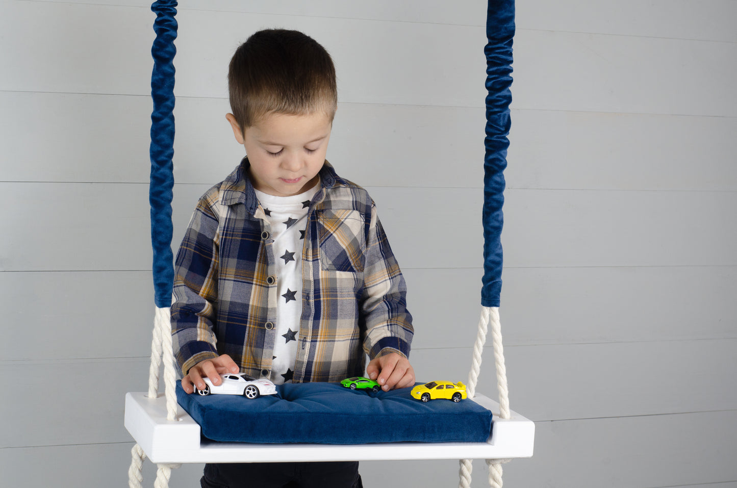 Children's Inside Natural Swing With A Blue Seat