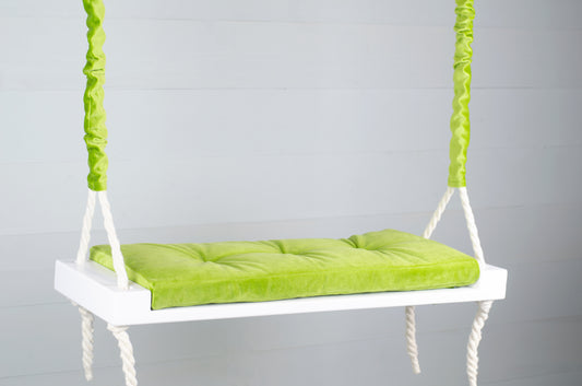 Adult Inside White Swing With A Green Seat