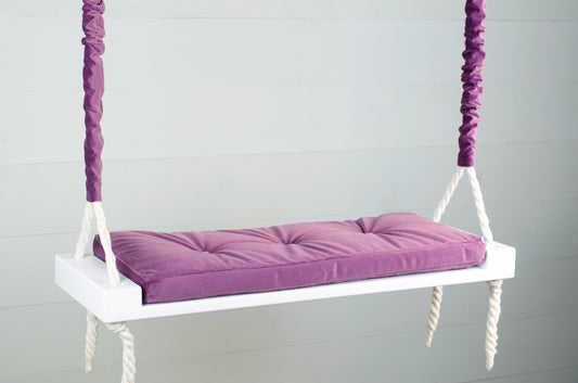 Adult Inside White Swing With A Purple Seat