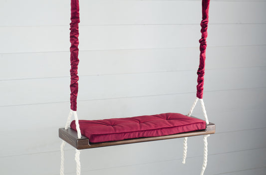 Adult Inside Natural Swing With A Red Seat