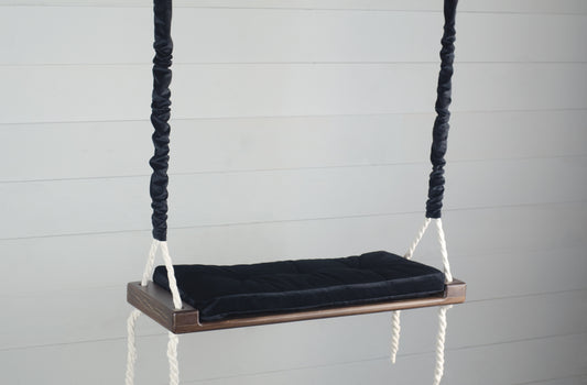 Adult Inside Natural Swing With A Black Seat