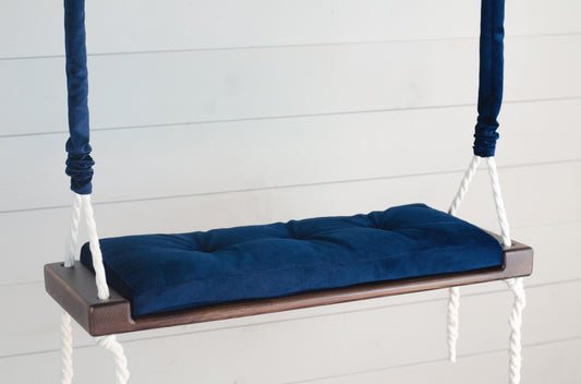 Adult Inside Natural Swing With A Blue Seat