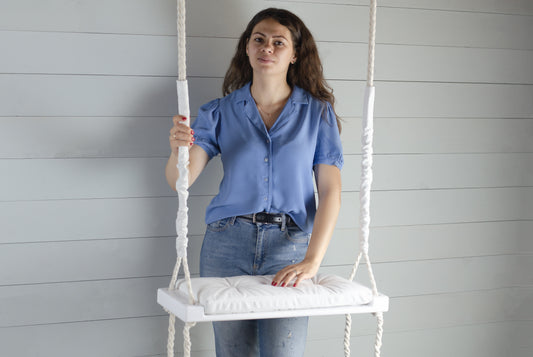 Adult Inside White Swing With A White Seat