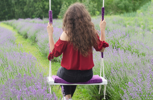 Adult Inside White Swing With A Purple Seat