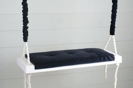 Adult Inside White Swing With A Black Seat